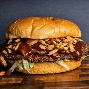 BBQ burger with American cheese, crispy onion strings, and honey mustard BBQ sauce from a Holland Michigan food truck