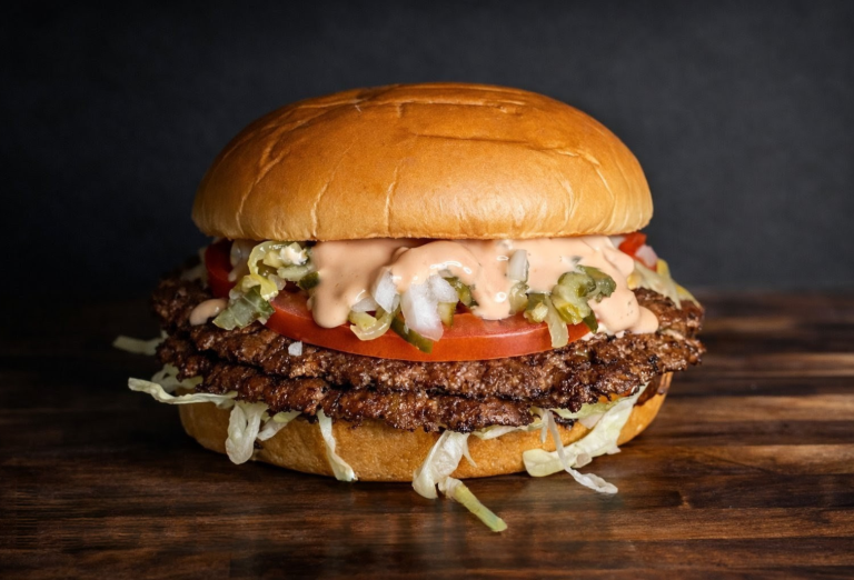 House burger with American and Swiss cheese, tomato, onion, pickles, lettuce, and house sauce from a Holland Michigan food truck