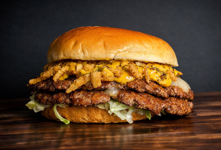 Spicy burger with pepper jack, jalapeno crisps, and crunchy garlic chili crisp aioli from a West Michigan food truck